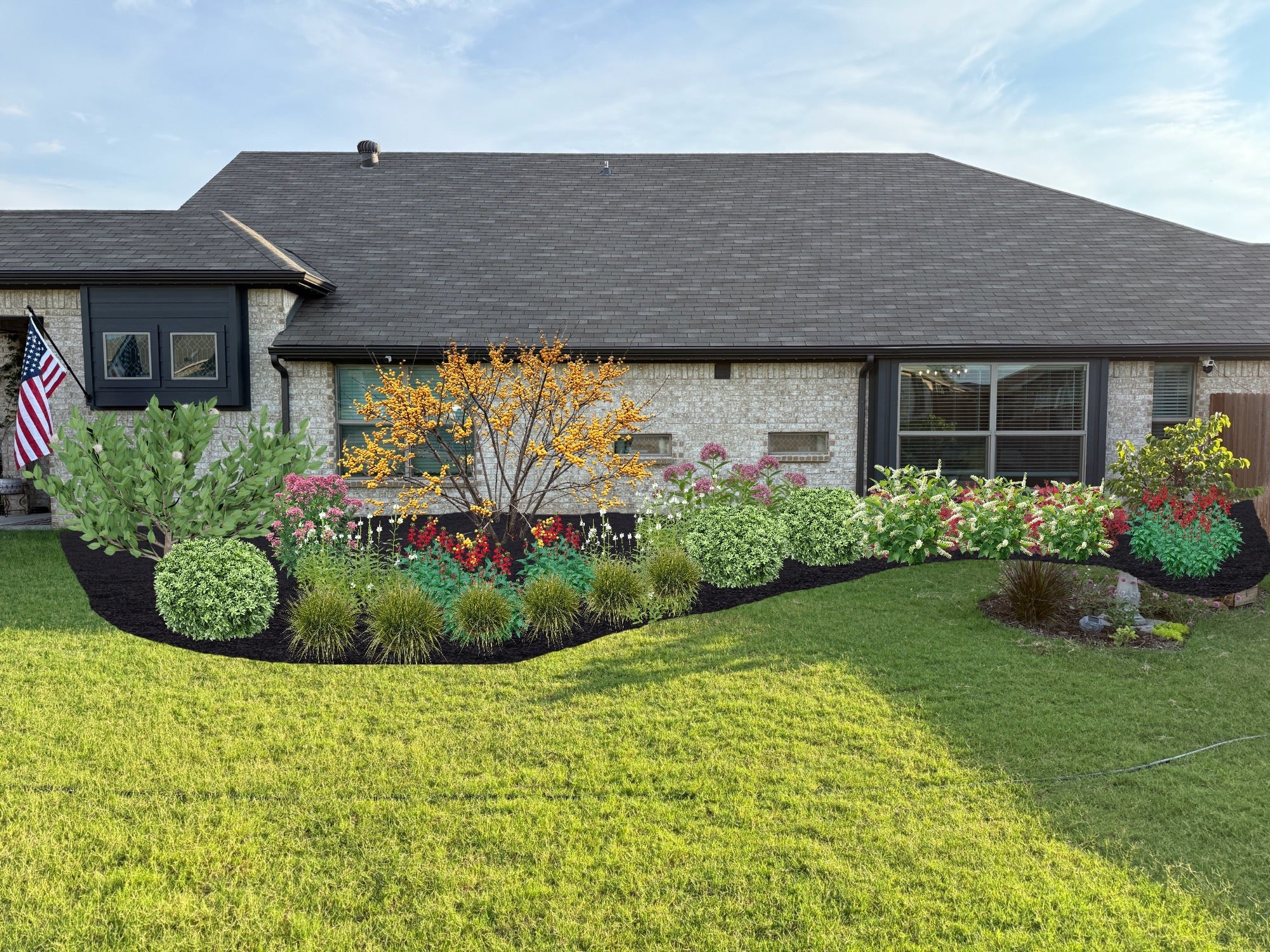 A beautiful foundation flowerbed showcasing a variety of perennial plants that handle soggy soil and heavy clay.